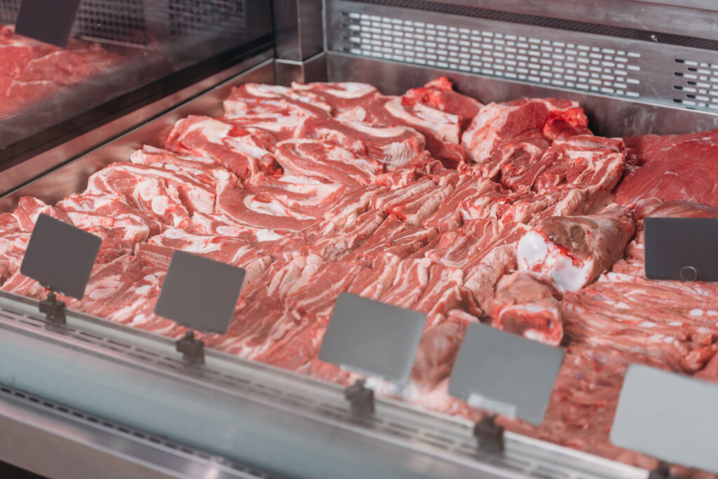 close up view of arranged raw meat in grocery shop