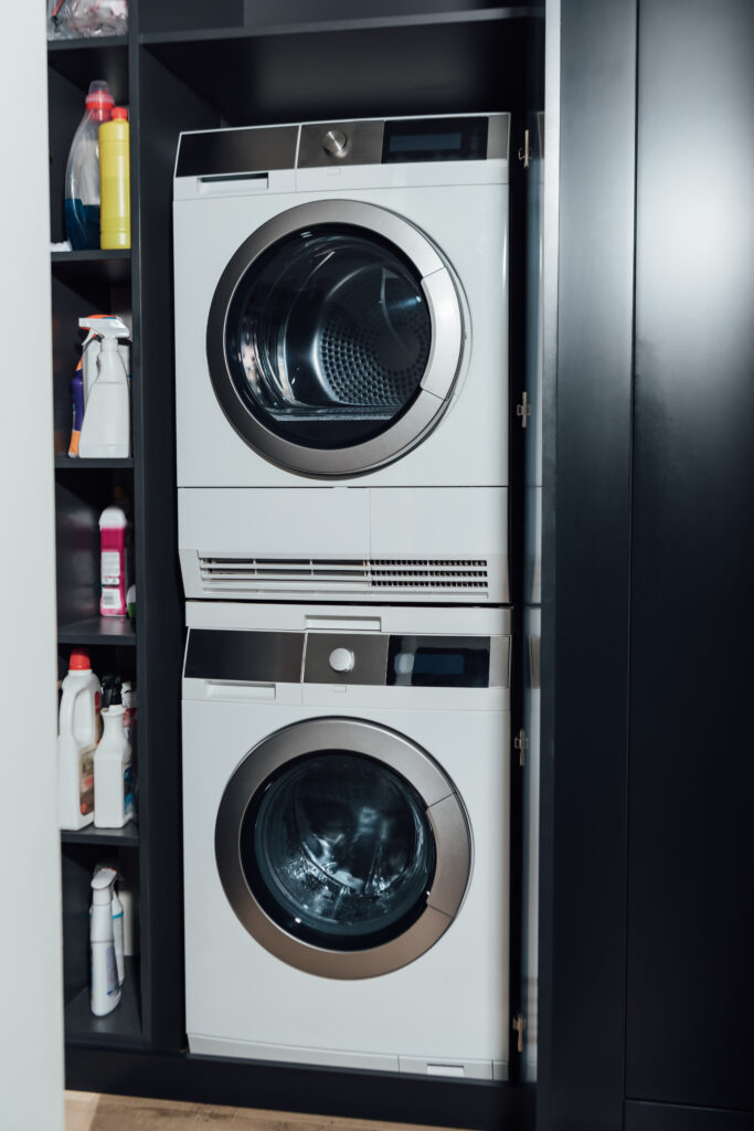 modern and white washing machines at home