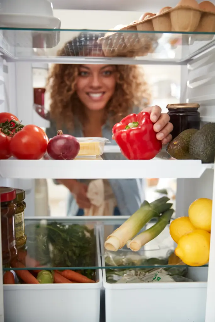 view looking out from inside of refrigerator as wo