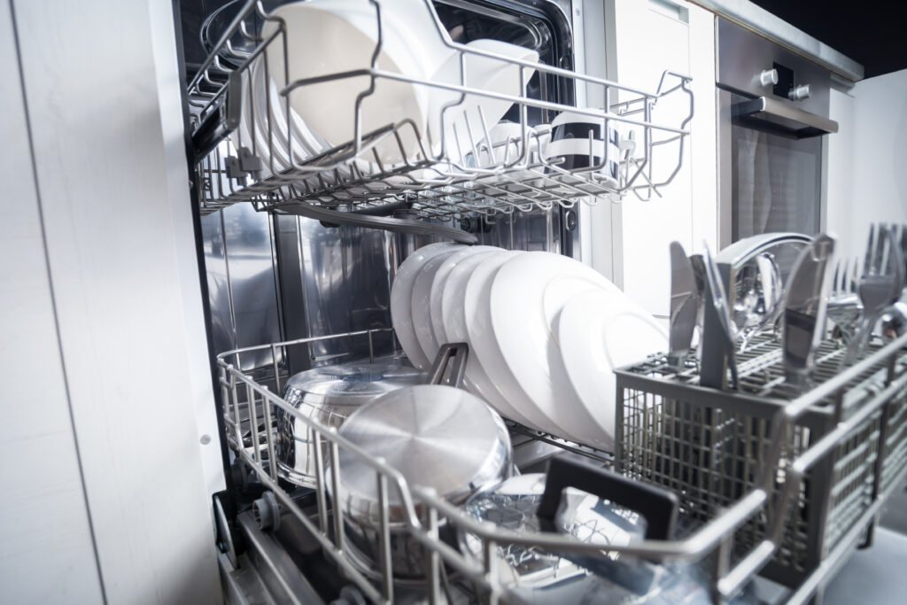 Clean dishes in dishwasher machine after washing